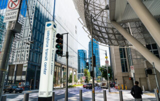 Salesforce transit center sign on a busy street in the financial sector