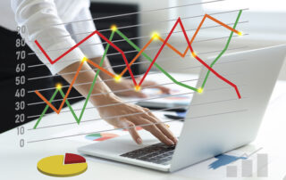 Woman using laptop analyzing sales data