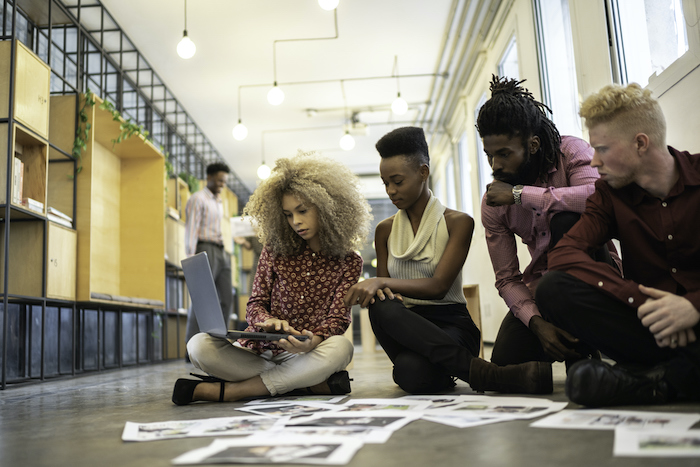 A business team researching how Salesforce can help their media company.